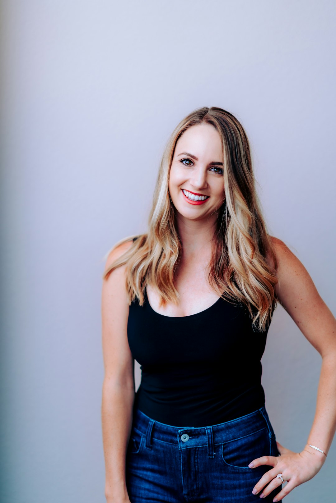 Photo by Meritt Thomas woman in black tank top smiling